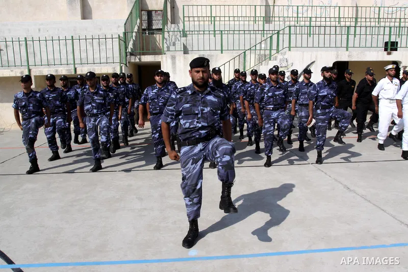 Palestinian Hamas officers and noncommissioned officers stand at attention to meet the new Director General of the Palestinian police Tayseer Al Batesh in Gaza city on June 7, 2011. Photo by Mohammed Asad