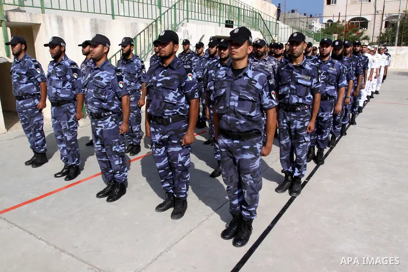 Palestinian Hamas officers and noncommissioned officers stand at attention to meet the new Director General of the Palestinian police Tayseer Al Batesh in Gaza city on June 7, 2011. Photo by Mohammed Asad
