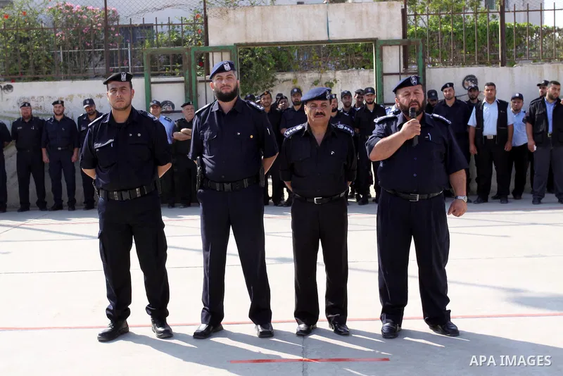 Palestinian Hamas officers and noncommissioned officers stand at attention to meet the new Director General of the Palestinian police Tayseer Al Batesh in Gaza city on June 7, 2011. Photo by Mohammed Asad