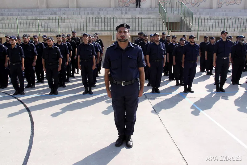 Palestinian Hamas officers and noncommissioned officers stand at attention to meet the new Director General of the Palestinian police Tayseer Al Batesh in Gaza city on June 7, 2011. Photo by Mohammed Asad