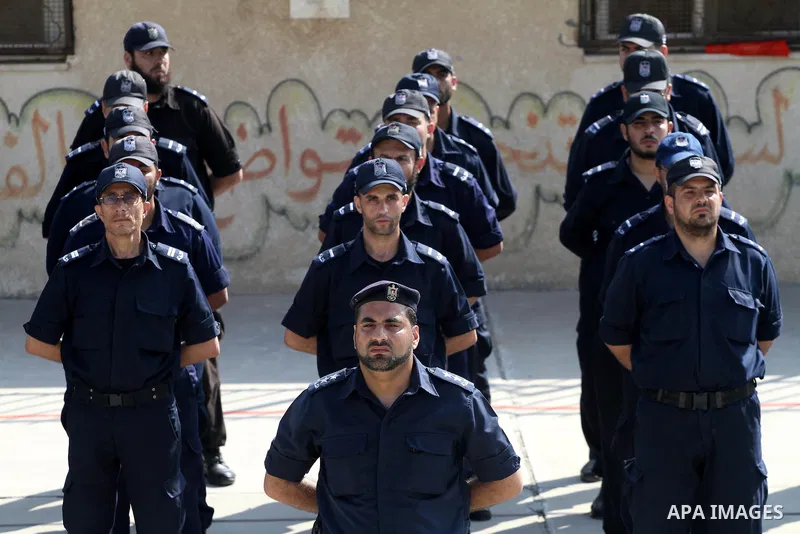 Palestinian Hamas officers and noncommissioned officers stand at attention to meet the new Director General of the Palestinian police Tayseer Al Batesh in Gaza city on June 7, 2011. Photo by Mohammed Asad