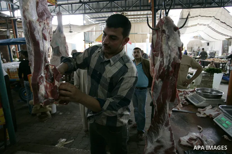 A Palestinian man sells beef in the market in Rafah refugee camp, southern Gaza Strip on June 7, 2011. Photo by Abed Rahim Khatib