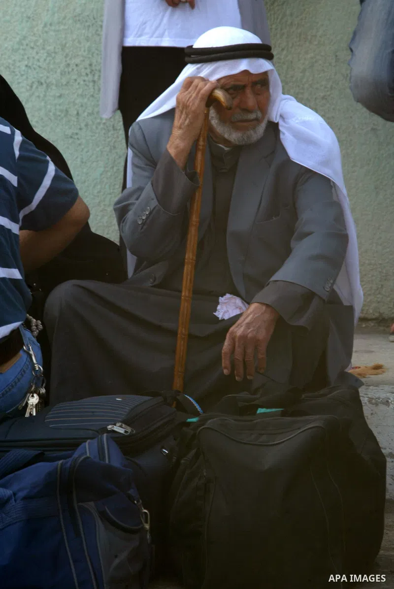 A Palestinian man waits to cross into Egypt through the Rafah border crossing in the southern Gaza Strip on June 8, 2011 after it was reopened, ending a four-day closure amid disagreements between Egyptian and Hamas offi...