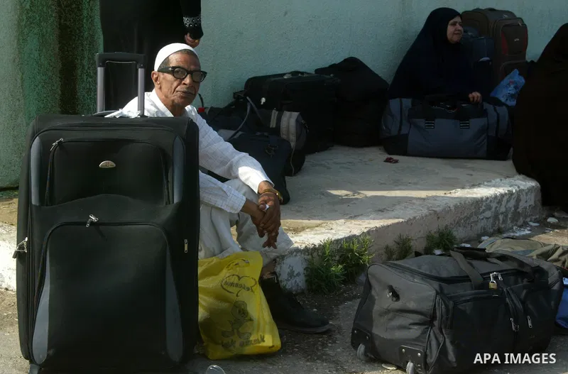 A Palestinian man waits to cross into Egypt through the Rafah border crossing in the southern Gaza Strip on June 8, 2011 after it was reopened, ending a four-day closure amid disagreements between Egyptian and Hamas offi...