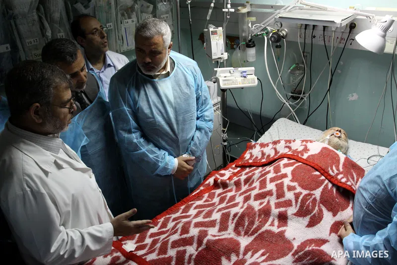 Palestinian Prime Minister in Gaza Strip, Ismail Haniya visits Mohammed Shamaa, one of the founders of Hamas Movement, at Al-Shefa Hospital in Gaza City on June 8,2011. Photo by Mohammed Asad