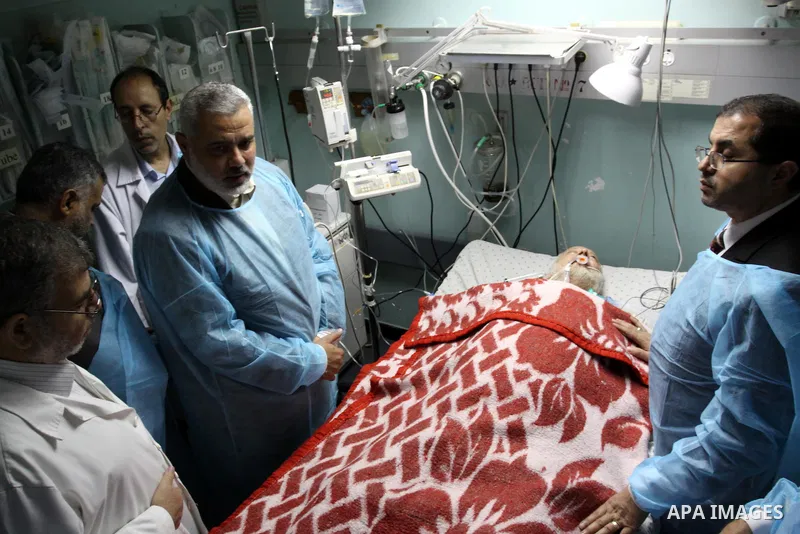 Palestinian Prime Minister in Gaza Strip, Ismail Haniya visits Mohammed Shamaa, one of the founders of Hamas Movement, at Al-Shefa Hospital in Gaza City on June 8,2011. Photo by Mohammed Asad