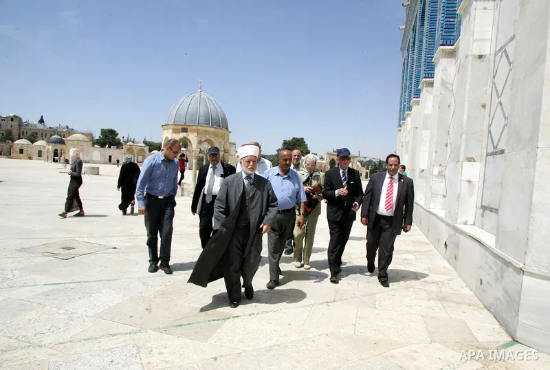 Palestinian Grand Mufti, Mohammed Hussein with the former Prime Minister of Norway and his wife tour inside Al-Aqsa mosque compound during their visit to Jerusalem's old city on June 9,2011.. Photo by Mahfouz Abu Turk