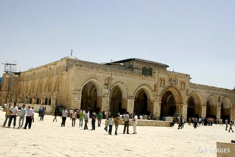 Palestinian Muslim worshipers walk in front of the Al-Aqsa mosque after Friday prayer at the Al-Aqsa mosque compound in Jerusalem's Old City on June 10, 2011. Photo by Mahfouz Abu Turk