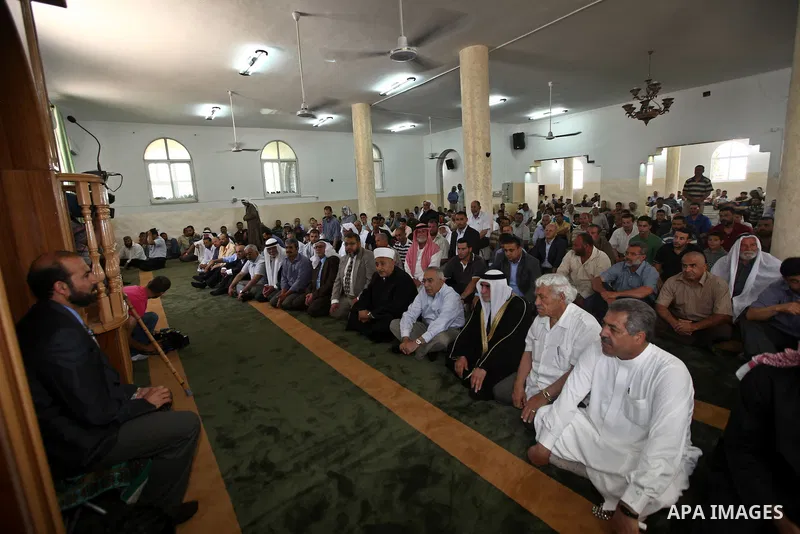 Palestinian Prime Minister, Salam Fayyad attends Friday prayers inside the mosque which was burnt and vandalized mosque by Israeli settlers in the West Bank al-Mughayyir village, some 20 kilometres (12 miles) northeast o...