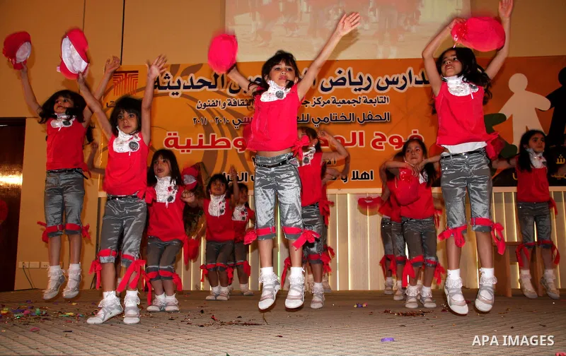 Palestinian children participate in the graduation ceremony at their kindergarten in the West Bank city of Nablus on June 12,2011. Photo by Wagdi Eshtayah