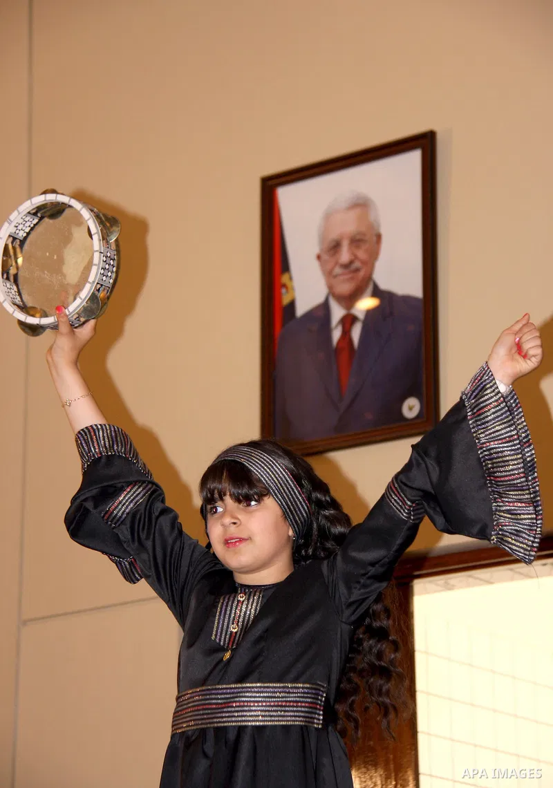 Palestinian children participate in the graduation ceremony at their kindergarten in the West Bank city of Nablus on June 12,2011. Photo by Wagdi Eshtayah