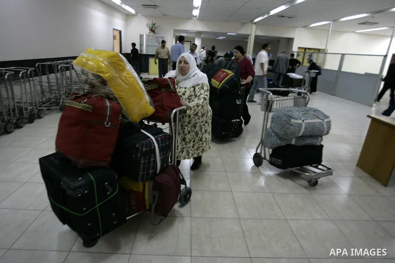 Palestinians load their luggage coming from Egypt through the Rafah border crossing in the southern Gaza Strip on on June 13, 2011. Photo by Abed Rahim Khatib