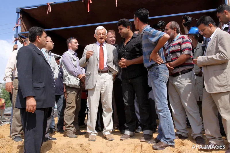 European Parliament President Jerzy Buzek (C) visits a UN aid center in al-Shati refugee camp in Gaza City on June 13, 2011. Photo by Mohammed Asad