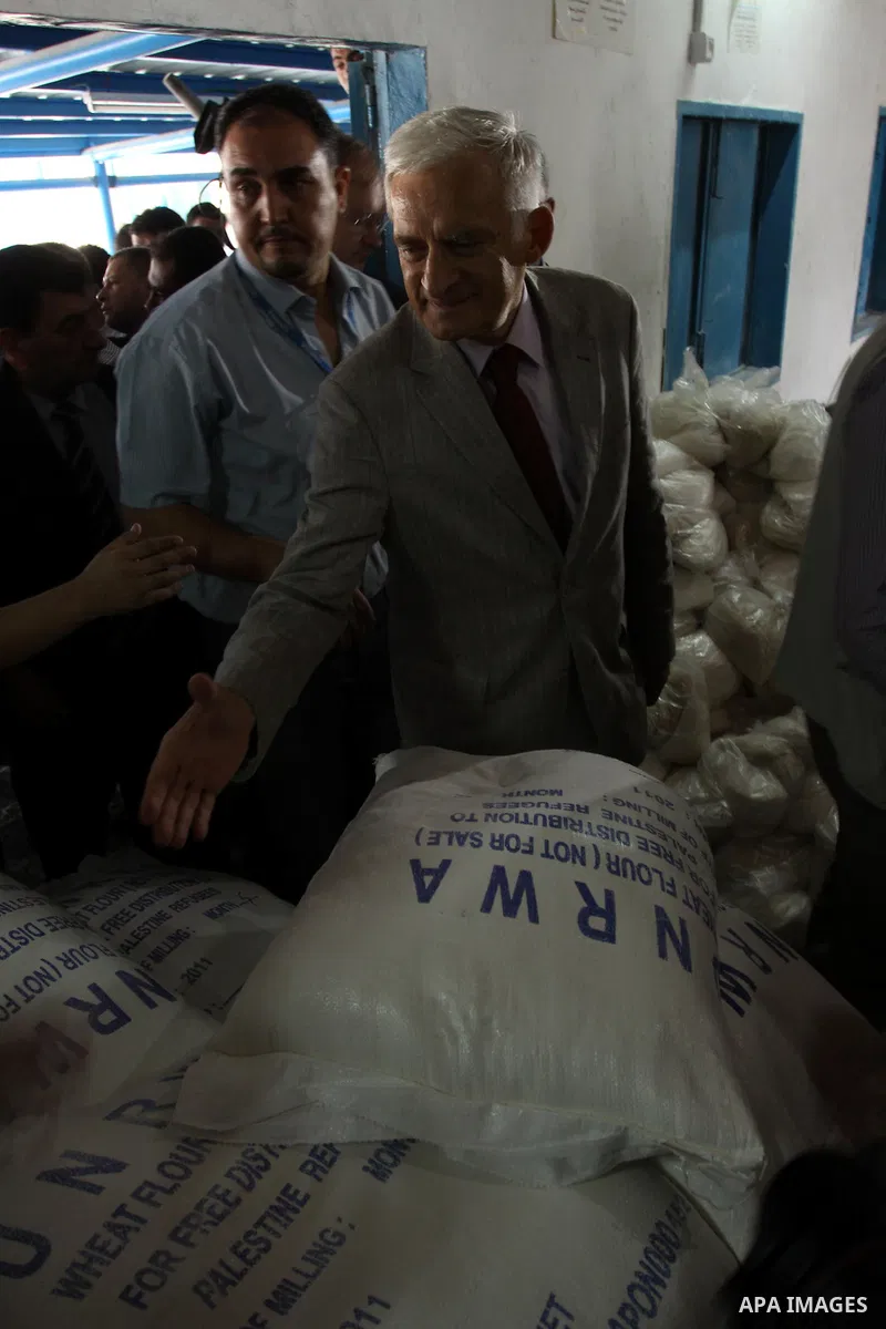 European Parliament President Jerzy Buzek (C) visits a UN aid center in al-Shati refugee camp in Gaza City on June 13, 2011. Photo by Mohammed Asad