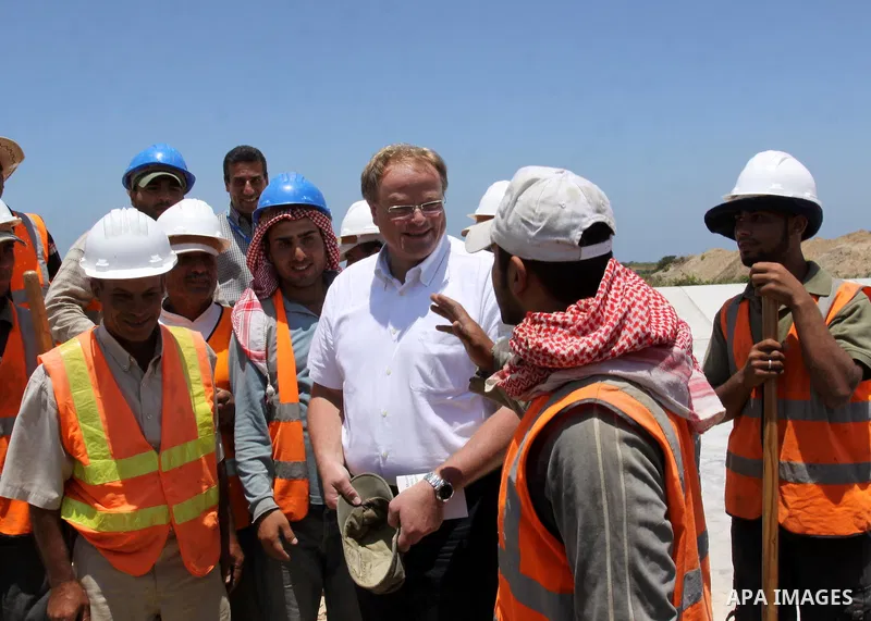 German Development Minister, Dirk Nebel speaks with labourers working in Gaza water treatment plant in Gaza city on June 14,2011. Photo by Mohammed Asad