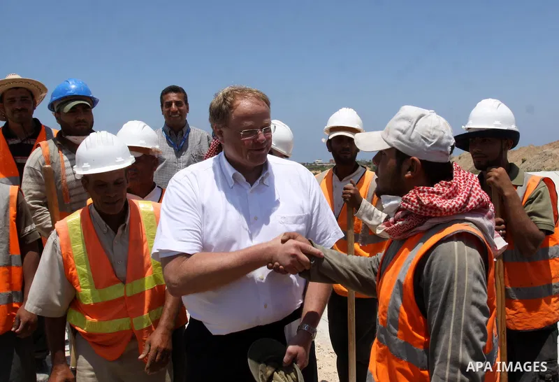 German Development Minister, Dirk Nebel speaks with labourers working in Gaza water treatment plant in Gaza city on June 14,2011. Photo by Mohammed Asad