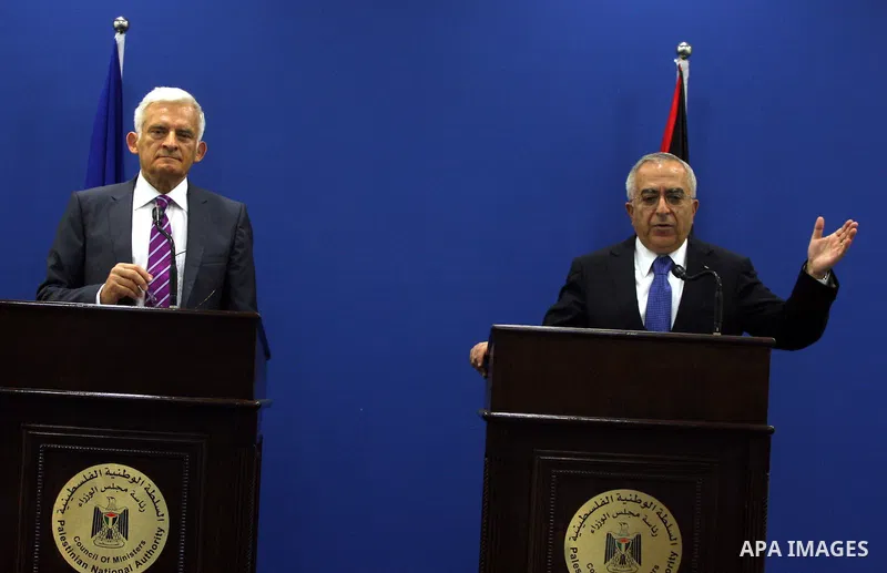 Palestinian Prime Minister Salam Fayyad speaks during a joint press conference with European Parliament President Jerzy Buzek in the West Bank city of Ramallah on June 14, 2011. Photo by Issam Rimawi