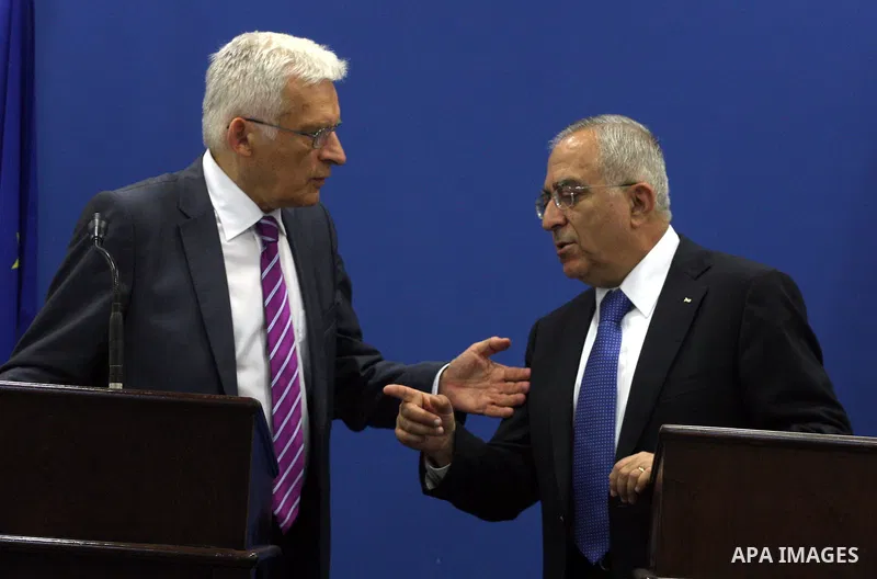 European Parliament President Jerzy Buzek speaks with Palestinian Prime Minister Salam Fayyad during a joint press conference in the West Bank city of Ramallah on June 14, 2011. Photo by Issam Rimawi
