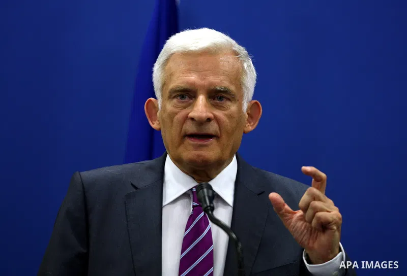 European Parliament President Jerzy Buzek gestures as he speaks during a joint press conference with Palestinian Prime Minister Salam Fayyad in the West Bank city of Ramallah on June 14, 2011. Photo by Issam Rimawi