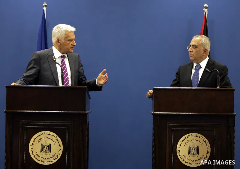 European Parliament President Jerzy Buzek speaks with Palestinian Prime Minister Salam Fayyad during a joint press conference in the West Bank city of Ramallah on June 14, 2011. Photo by Issam Rimawi