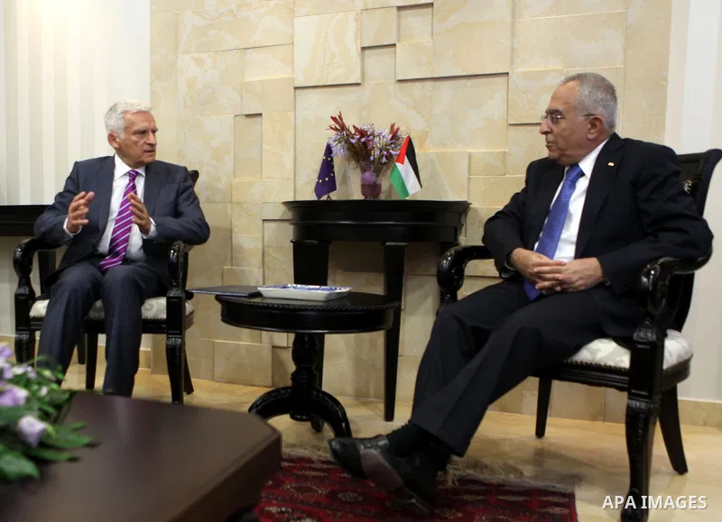 European Parliament President Jerzy Buzek speaks with Palestinian Prime Minister Salam Fayyad during their meeting in the West Bank city of Ramallah on June 14, 2011. Photo by Issam Rimawi