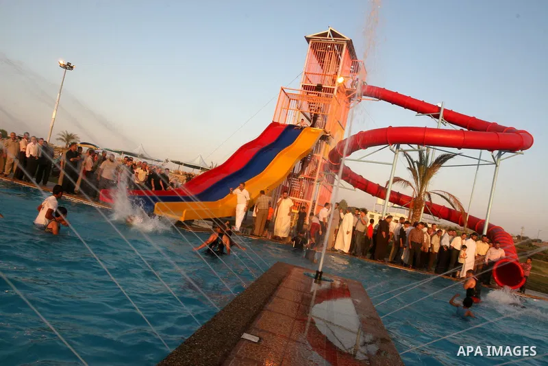 Palestinians enjoy swimming in a pool at the newly-opened "Asda City" touristic resort in Khan Yunis, south of the Gaza Strip, on June 14, 2011. Photo by Majdi Fathi
