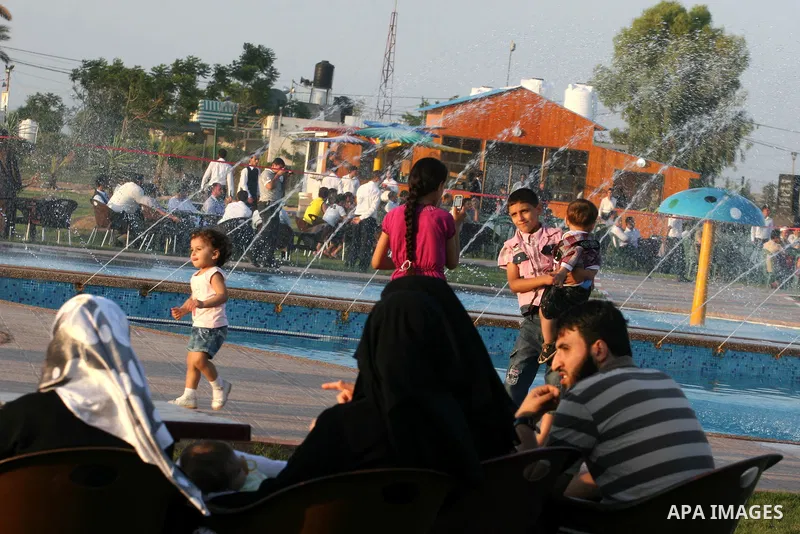 Palestinians enjoy swimming in a pool at the newly-opened "Asda City" touristic resort in Khan Yunis, south of the Gaza Strip, on June 14, 2011. Photo by Majdi Fathi