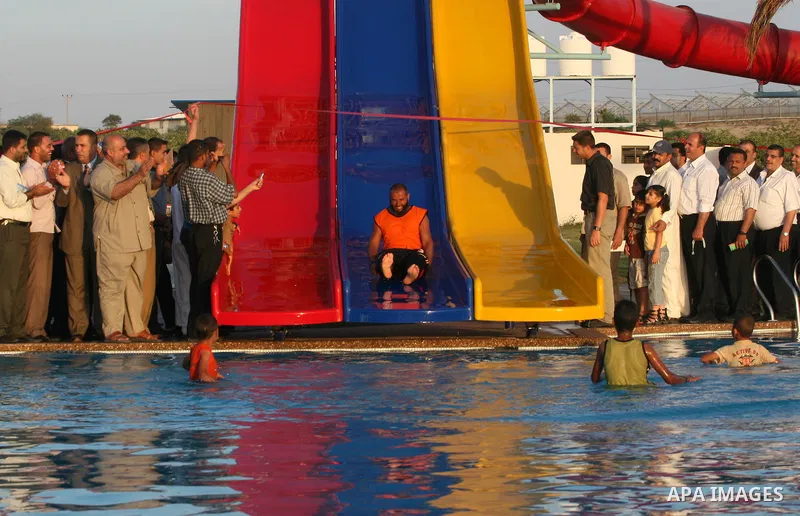 Palestinians enjoy swimming in a pool at the newly-opened "Asda City" touristic resort in Khan Yunis, south of the Gaza Strip, on June 14, 2011. Photo by Majdi Fathi
