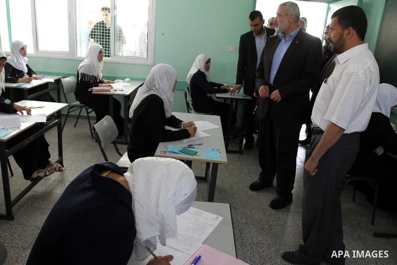 Palestinian Prime Minister in Gaza Strip, Ismail Haniya visits students as they sit for their final high school exams, known as "Tawjihi", in Gaza City on June 15, 2011. Photo by Mohammed Asad