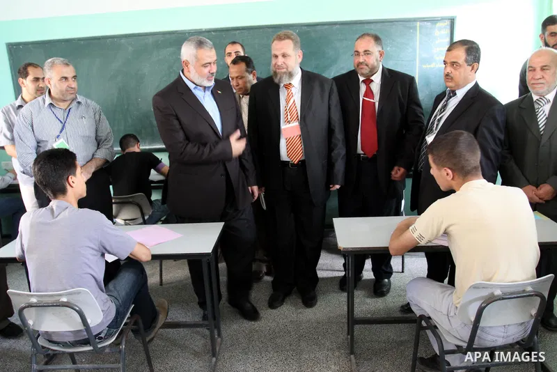 Palestinian Prime Minister in Gaza Strip, Ismail Haniya visits students as they sit for their final high school exams, known as "Tawjihi", in Gaza City on June 15, 2011. Photo by Mohammed Asad