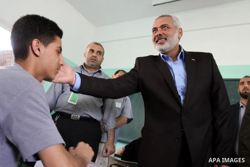 Palestinian Prime Minister in Gaza Strip, Ismail Haniya visits students as they sit for their final high school exams, known as "Tawjihi", in Gaza City on June 15, 2011. Photo by Mohammed Asad