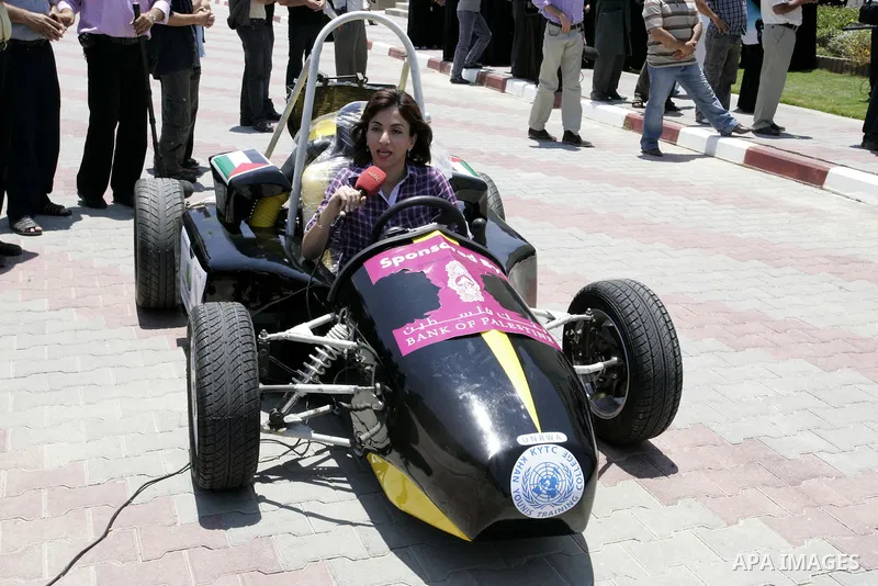 Palestinian students test their Formula 1-style racing car, made from scratch out of recycled parts, they have produced at their technical college run by the United Nations in Khan Yunis, southern Gaza Strip, on June 15,...