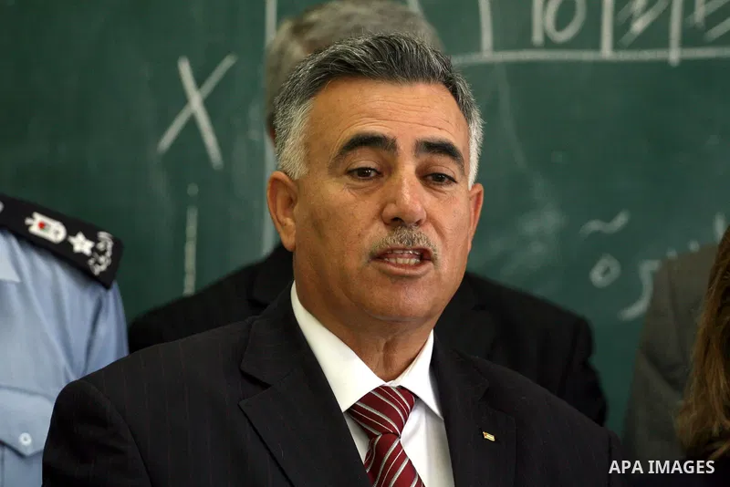 Palestinian Hussein Al-Araj, the representative of the Palestinian President Mahmoud Abbas, visits students as they sit for their final high school exams, known as "Tawjihi", in the West Bank city of Ramallah on June 14,...