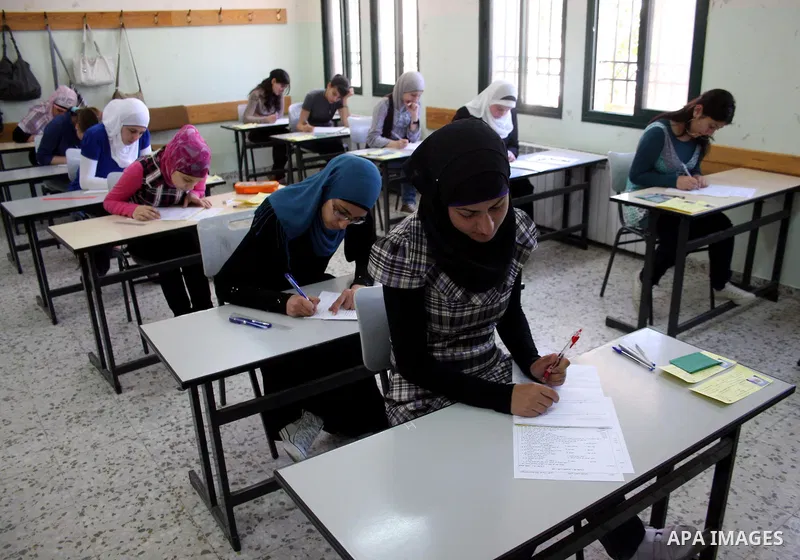 Palestinian students sit for their final high school exams, known as "Tawjihi", in the West Bank city of Ramallah on June 15, 2011. Photo by Issam Rimawi