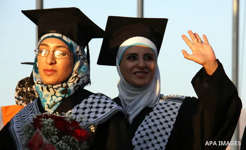 Palestinian students attend a graduation ceremony at the An Najah University in the West Bank city of Nablus ,Wednesday, June 15, 2011. Photo by Wagdi Eshtayah ..