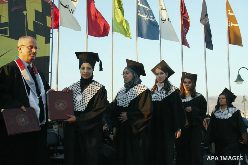 Palestinian students attend a graduation ceremony at the An Najah University in the West Bank city of Nablus ,Wednesday, June 15, 2011. Photo by Wagdi Eshtayah ..