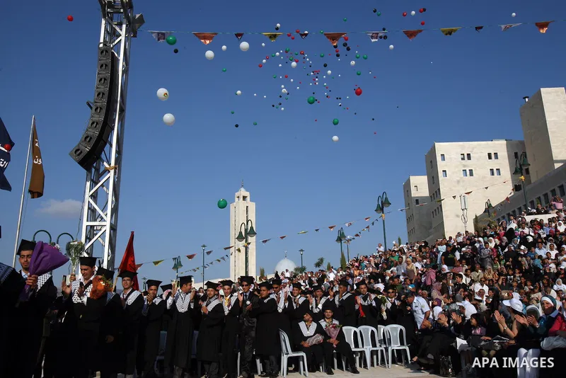 Palestinian students attend a graduation ceremony at the An Najah University in the West Bank city of Nablus ,Wednesday, June 15, 2011. Photo by Wagdi Eshtayah ..