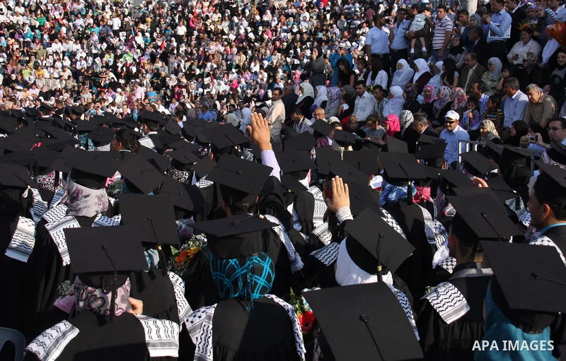 Palestinian students attend a graduation ceremony at the An Najah University in the West Bank city of Nablus ,Wednesday, June 15, 2011. Photo by Wagdi Eshtayah ..