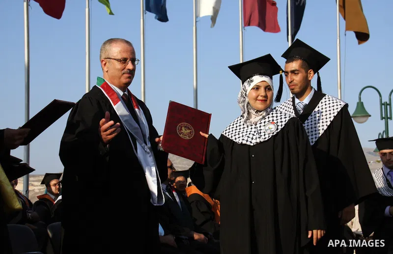 Palestinian students attend a graduation ceremony at the An Najah University in the West Bank city of Nablus ,Wednesday, June 15, 2011. Photo by Wagdi Eshtayah ..