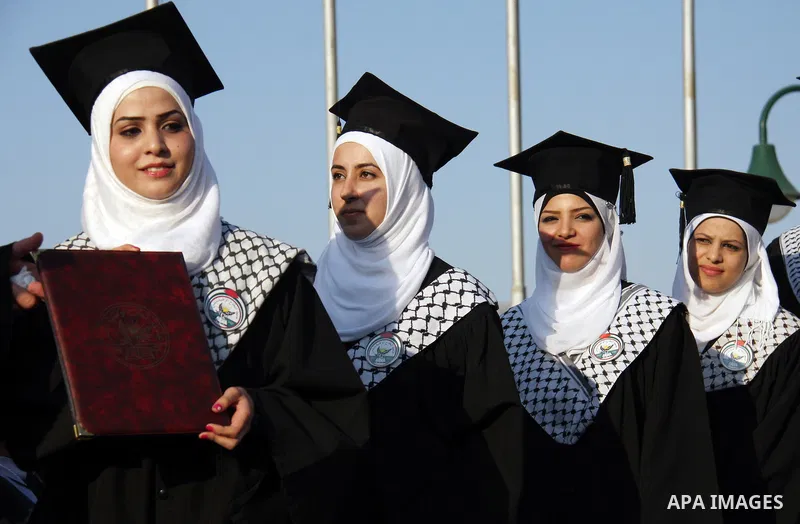 Palestinian students attend a graduation ceremony at the An Najah University in the West Bank city of Nablus ,Wednesday, June 15, 2011. Photo by Wagdi Eshtayah ..