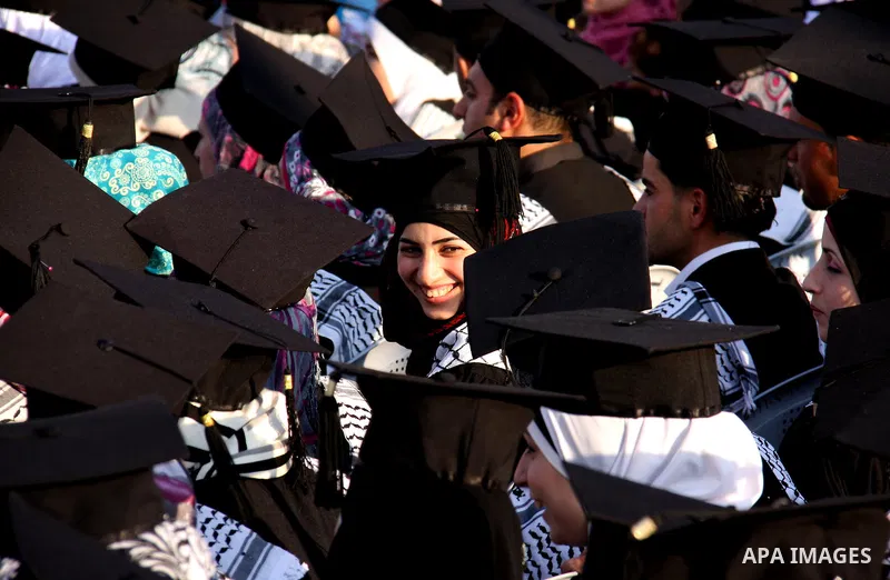 Palestinian students attend a graduation ceremony at the An Najah University in the West Bank city of Nablus ,Wednesday, June 15, 2011. Photo by Wagdi Eshtayah ..