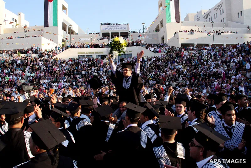 Palestinian students attend a graduation ceremony at the An Najah University in the West Bank city of Nablus ,Wednesday, June 15, 2011. Photo by Wagdi Eshtayah ..