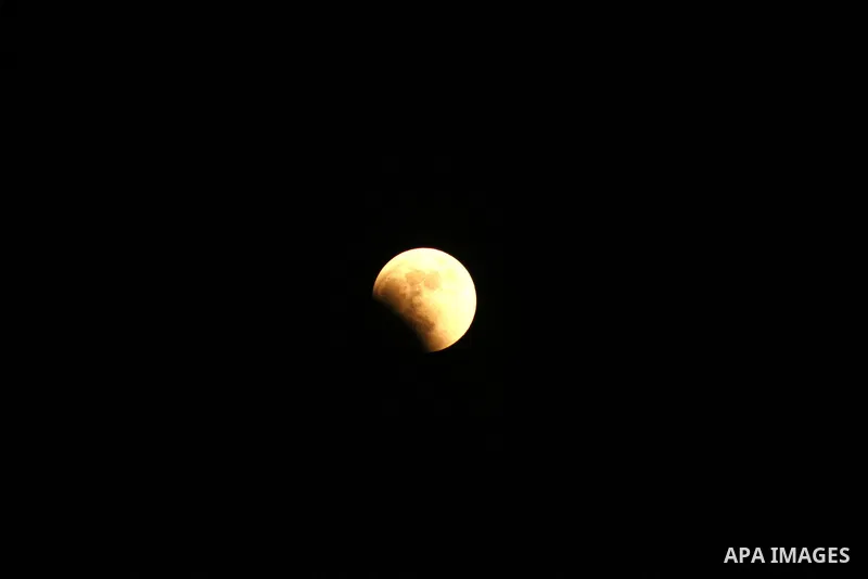 A Portion of the moon crosses into the Earth's shadow seen from Gaza city, on June 15, 2011. Astronomers in parts of Europe, Africa, Central Asia and Australia were hoping for clear skies on June 15 to enjoy a total luna...