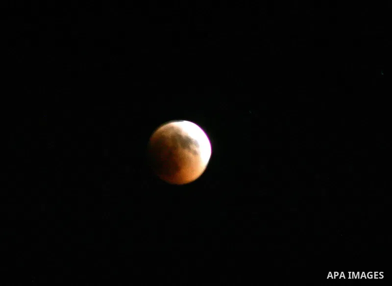 A Portion of the moon crosses into the Earth's shadow seen from Jerusalem City, on June 15, 2011. Astronomers in parts of Europe, Africa, Central Asia and Australia were hoping for clear skies on June 15 to enjoy a total...