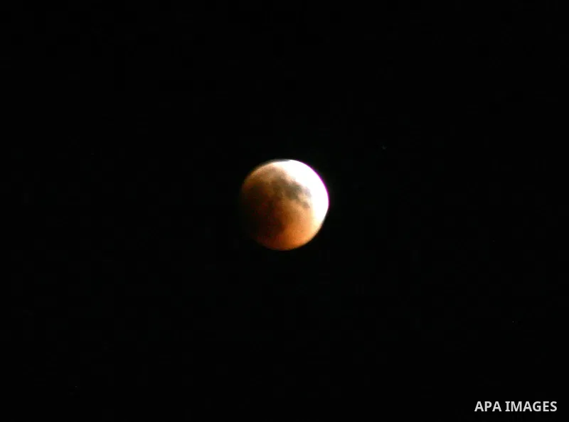 A Portion of the moon crosses into the Earth's shadow seen from Jerusalem City, on June 15, 2011. Astronomers in parts of Europe, Africa, Central Asia and Australia were hoping for clear skies on June 15 to enjoy a total...