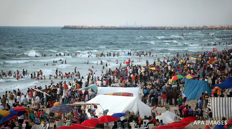 Palestinians on a beach in the west of Gaza City 17 June 2011. Reports state that during the summer the beach is a major venue for entertainment and leisure in the Gaza Strip. Photo by Ali Jadallah