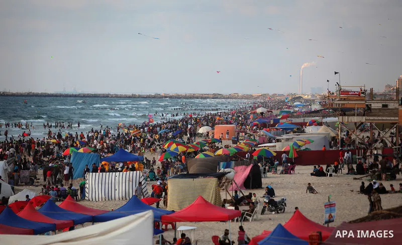 Palestinians on a beach in the west of Gaza City 17 June 2011. Reports state that during the summer the beach is a major venue for entertainment and leisure in the Gaza Strip. Photo by Ali Jadallah