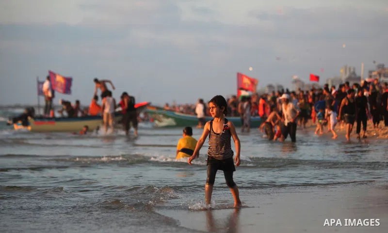 Palestinians bathing in the sea off on a beach in the west of Gaza City 17 June 2011. Reports state that during the summer the beach is a major venue for entertainment and leisure in the Gaza Strip.. Photo by Ali Jadalla...