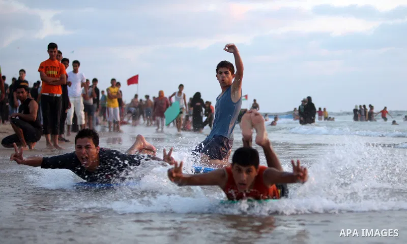 Palestinians bathing in the sea off on a beach in the west of Gaza City 17 June 2011. Reports state that during the summer the beach is a major venue for entertainment and leisure in the Gaza Strip.. Photo by Ali Jadalla...