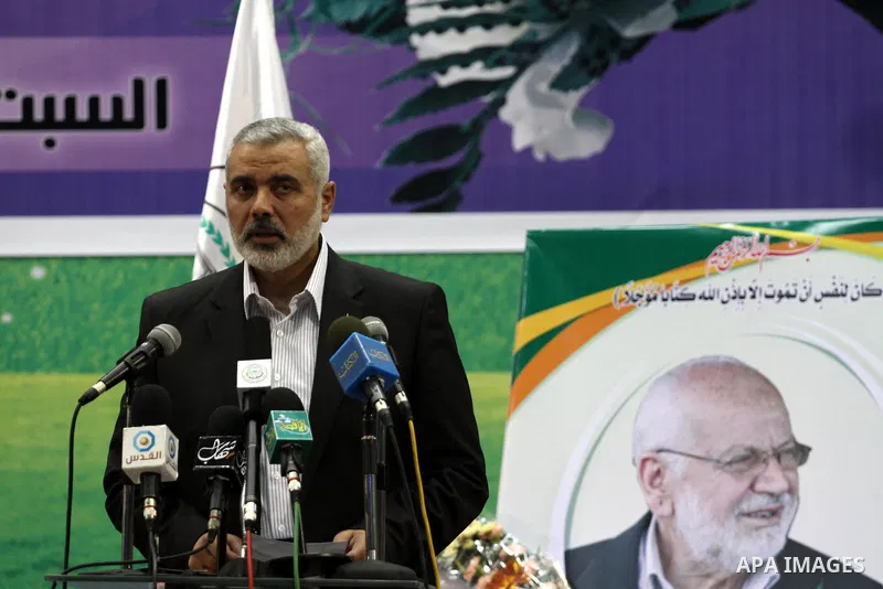 Palestinian Prime Minister in Gaza, Ismail Haniya delivers a speech during the memorial service of Mohammed Shama`, a leader of the Brotherhood and one of the founders of Hamas in the Islamic University in Gaza City on J...